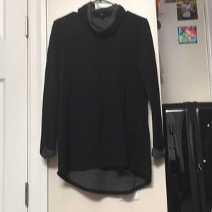 Black, long sleeved top.